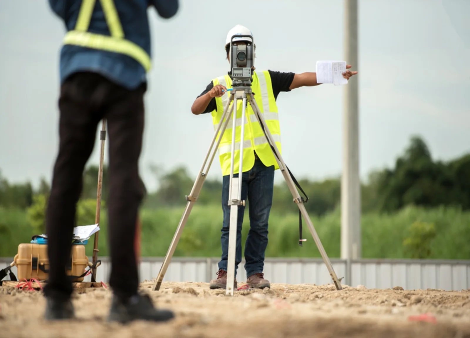 Survey crew performing staking on a construction site