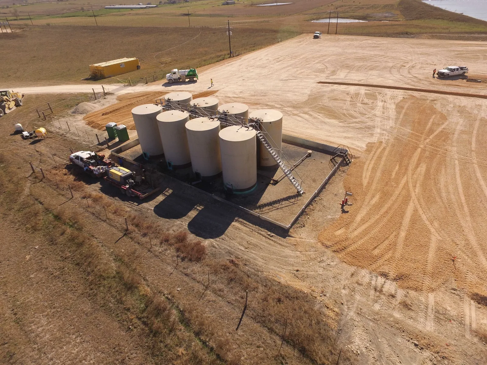 Survey drone flying over an active construction or facility site