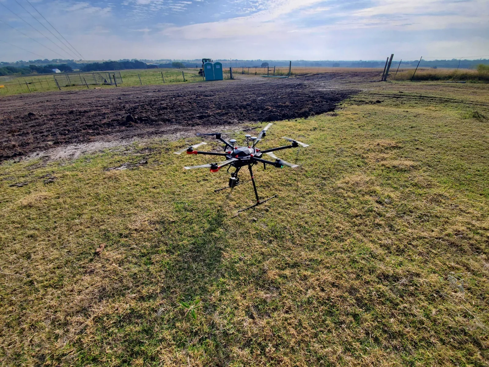 Drone set up in a field ready for a photogrammetry flight