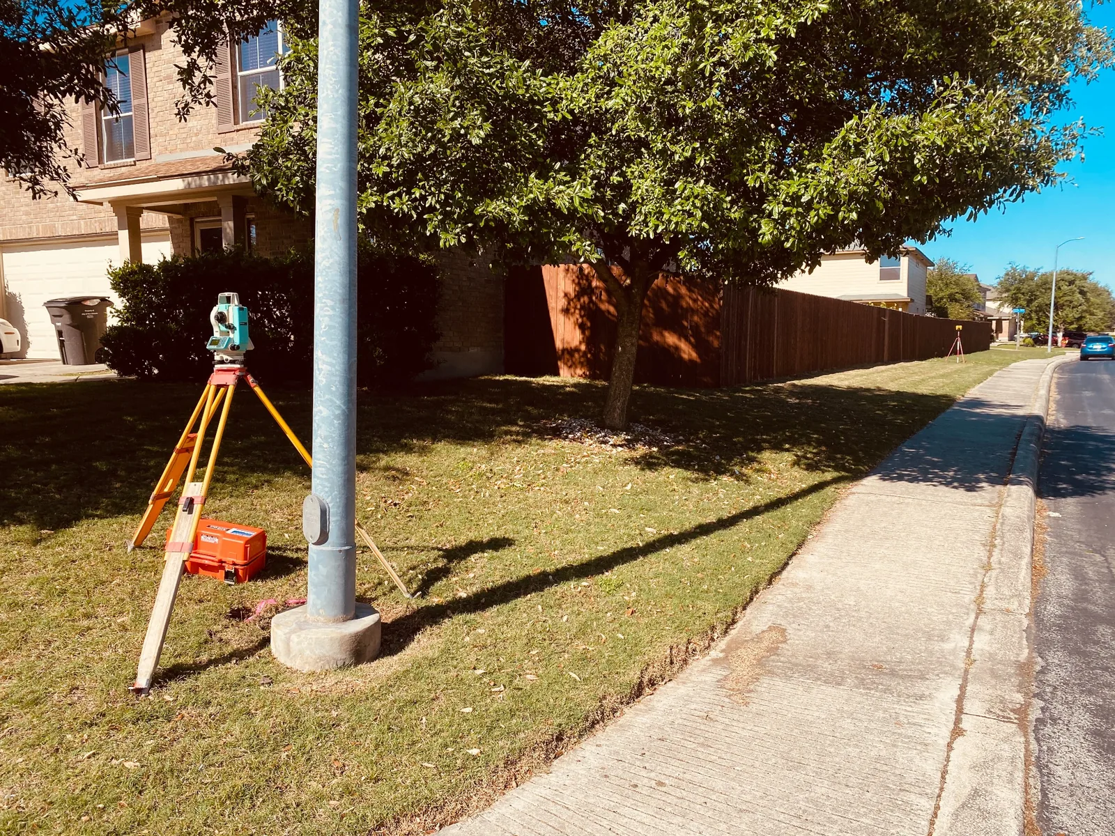 Total station set up along a residential property line and lot survey